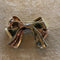 Broche Broche noeud or jaune & rose rubis & diamants 58 Facettes CEY26