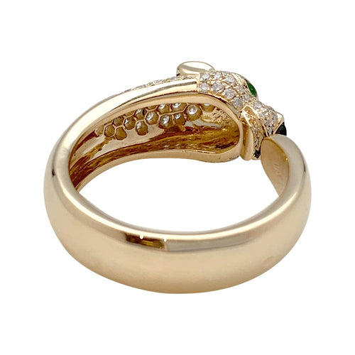 Bague 67 Bague Cartier modèle "Panthère" en or jaune, onyx, émeraudes et diamants. 58 Facettes 29715-1