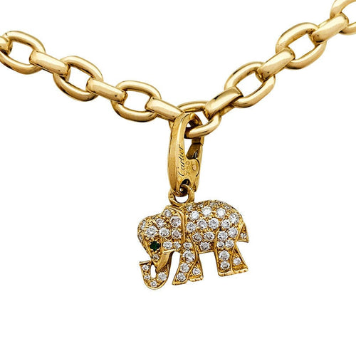 Bracelet Bracelet Cartier en or jaune, 6 breloques, diamants, émeraudes et rubis. 58 Facettes 30849/55