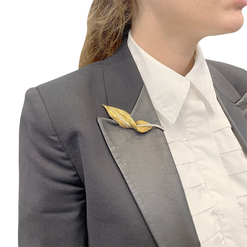 Broche Broche Hermès, "Plume", or jaune, platine, diamants. 58 Facettes 32105
