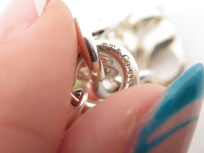 Bracelet bracelet TIFFANY & CO chaine a breloques charms 19 argent 58 Facettes 254453