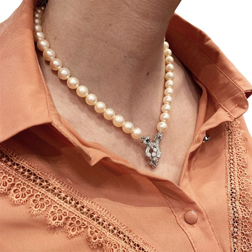 Collier Collier perles, or blanc et diamants. 58 Facettes 30937