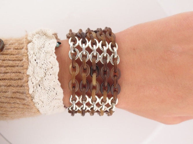 Bracelet bracelet HERMES manchette maillons 18 cm argent 925 et corne de buffle 58 Facettes 257682