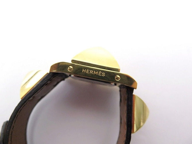 Montre montre HERMES medor 23 mm quartz en plaque or et cuir noir en 58 Facettes 243860