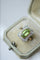 Bague Bague Belle Epoque Péridot entourage diamants 58 Facettes