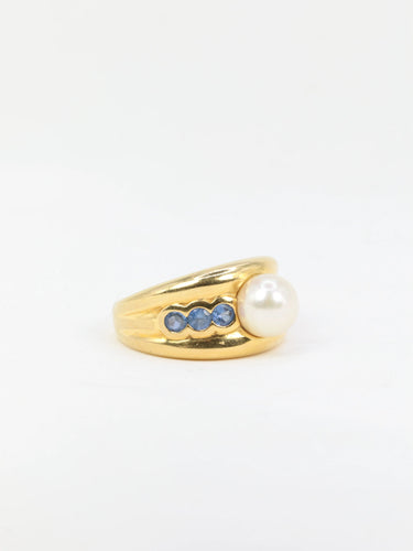 Bague Bague vintage en or jaune, perle et saphirs 58 Facettes 705