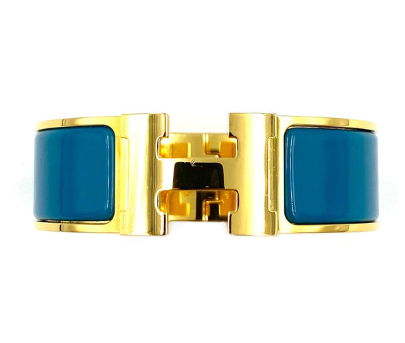 Bracelet HERMÈS. Bracelet métal doré et émail 58 Facettes
