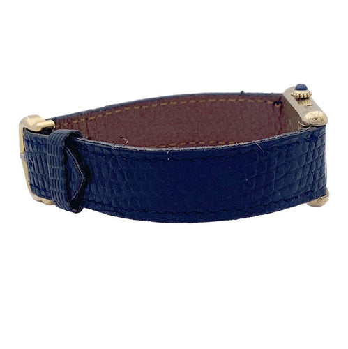 Montre Montre Cartier "Tank Must" argent plaqué or, cadran laqué bleu. 58 Facettes 33539