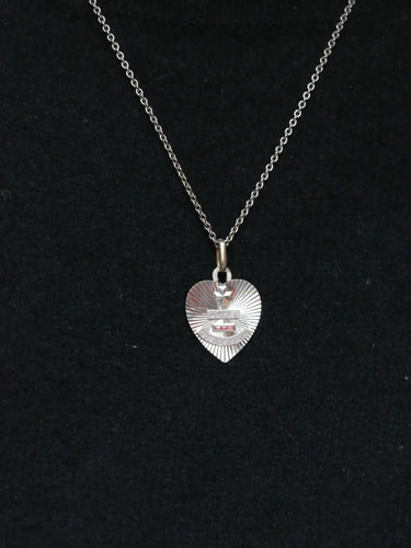 Pendentif Médaille amour Augis cœur Or blanc Rubis Plus qu’hier moins que demain 58 Facettes J238