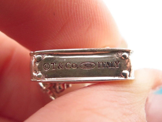 Bracelet bracelet TIFFANY & CO chaine a breloques charms 19 argent 58 Facettes 254453