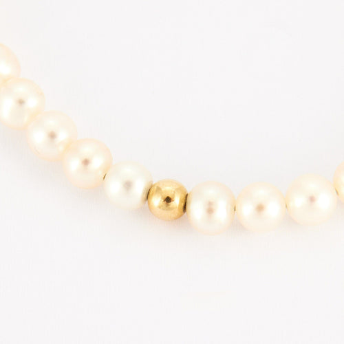 Bracelet Bracelet perles blanches et or jaune 58 Facettes P4L8