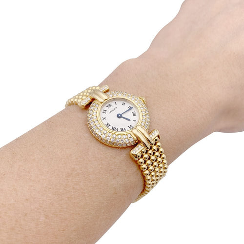 Montre Montre Cartier "Colisée", or jaune et diamants. 58 Facettes 33290