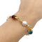 Bracelet Bracelet Bulgari en or jaune, perles, pierres de couleur. 58 Facettes 33083