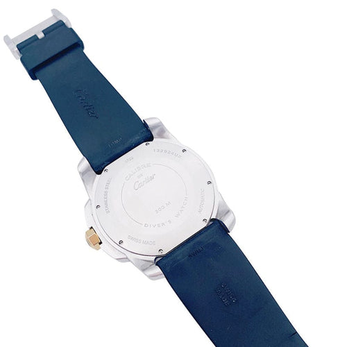 Montre Montre Cartier Calibre en or et acier sur bracelet caoutchouc. 58 Facettes 32552