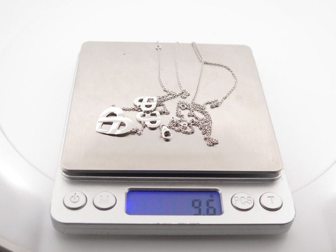 Collier collier POIRAY coeur entrelace multi 80-84 en or blanc 18k 58 Facettes 253874