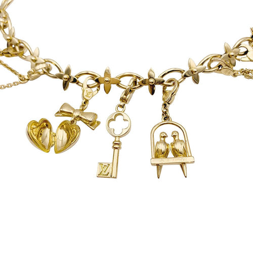 Bracelet Bracelet Louis Vuitton, "Idylle", breloques, or jaune, or blanc, perles. 58 Facettes 33013