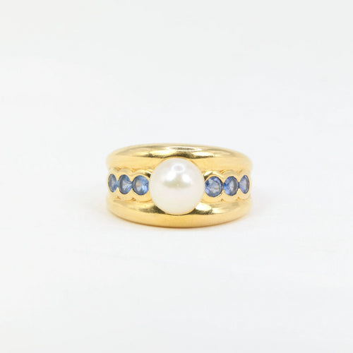 Bague Bague vintage en or jaune, perle et saphirs 58 Facettes 705