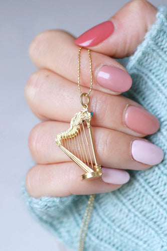 Pendentif Pendentif Victorien Harpe en or jaune et turquoise à compartiment secret 58 Facettes