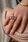 Bague Bague en or jaune, gris, rubis et diamants "Folles années" 58 Facettes 1828