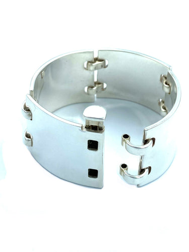 Bracelet HERMÈS. Bracelet manchette articulée argent 58 Facettes