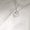 Pendentif TIFFANY & CO - Pendentif  "Please return to" argent 58 Facettes 25394