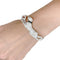 Bracelet Bracelet Cartier "Panthère de Cartier" en or blanc, diamants, émeraude et onyx. 58 Facettes 31544