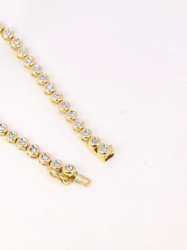 Bracelet Bracelet tennis vintage or jaune et diamants en serti clos 58 Facettes J92