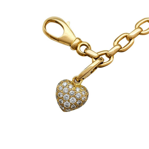 Bracelet Bracelet Cartier en or jaune, 6 breloques, diamants, émeraudes et rubis. 58 Facettes 30849/55