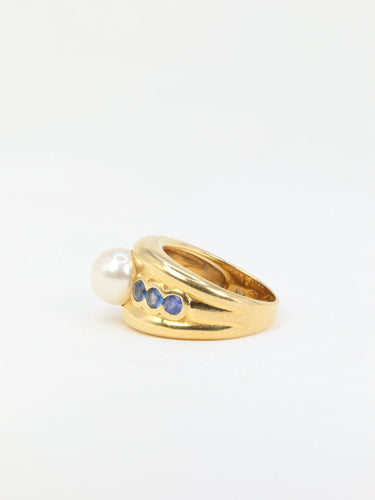 Bague Bague vintage en or jaune, perle et saphirs 58 Facettes 705