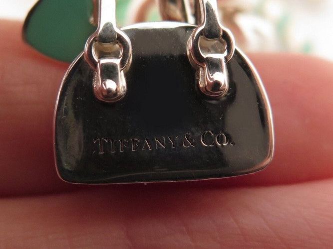 Bracelet bracelet TIFFANY & CO chaine a breloques charms 19 argent 58 Facettes 254453