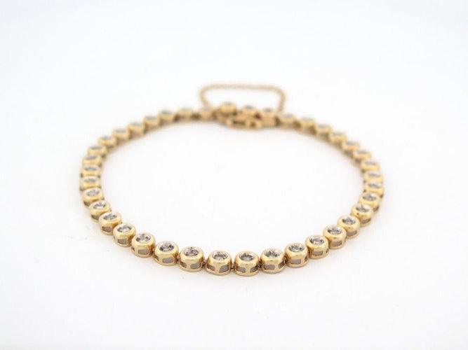 Bracelet vintage bracelet tennis serti de 39 diamants 1ct en or jaune 18k 58 Facettes 256655