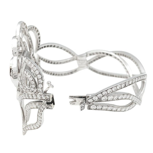Montre Montre Chanel "Fil de Camélia" en or blanc et diamants. 58 Facettes 31123
