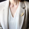 Broche Broche plume or jaune et perles de culture 58 Facettes CVBR32