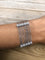 Bracelet Bracelet or gris et diamant motifs avec des fleurs 58 Facettes