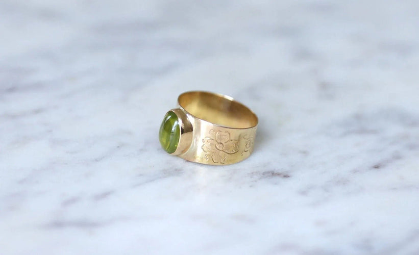 Bague 57 Bague bandeau or rose et cabochon péridot 58 Facettes