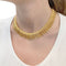 Collier Collier en or jaune à franges de fils torsadés. 58 Facettes 32348