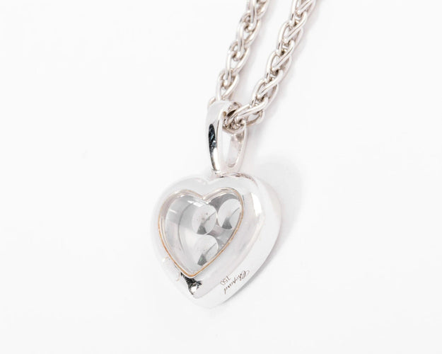 Pendentif Un pendentif or gris signé de la maison Chopard 58 Facettes