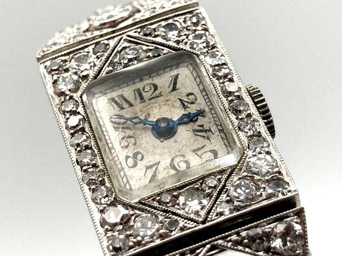 Montre Montre Art Déco platine & or blanc, diamants 2.44 cts 58 Facettes 07/07 - 16