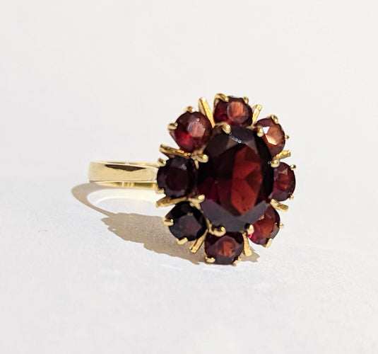 Bague Bague Marguerite or et grenats 58 Facettes