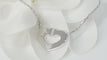 Collier Collier Cartier Symboles cœur en or blanc 58 Facettes