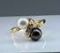 Bague 50.5 Bague en or jaune 18 carats, perle de Tahiti, perle de culture blanche et diamants 58 Facettes AB264