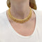 Collier Collier en or jaune à franges de fils torsadés. 58 Facettes 32348