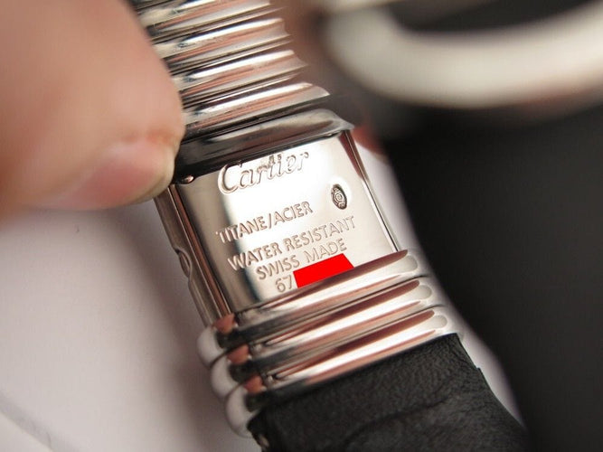 Montre vintage montre CARTIER declaration titane & acier 4 diamants 0.12ct quartz 58 Facettes 254101