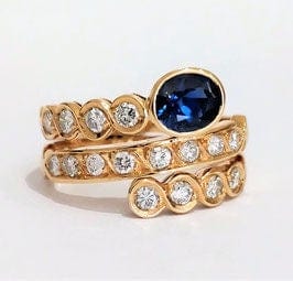 Bague 57 Bague "enroulement" or jaune saphir et diamants 58 Facettes 1-144/2