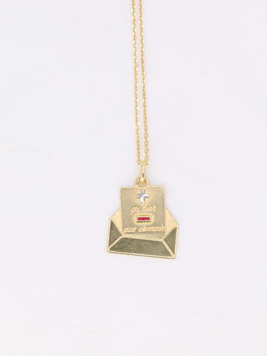 Pendentif Médaille Augis lettre d’amour or et rubis, Plus qu’hier moins que demain 58 Facettes 921