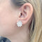 Boucles d'oreilles Boucles d'oreilles Van Cleef & Arpels "Lotus" or blanc, diamants. 58 Facettes 33565