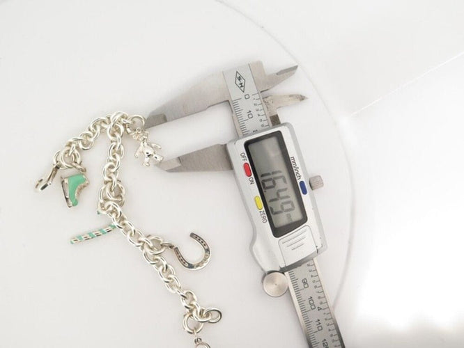 Bracelet bracelet TIFFANY & CO chaine a breloques charms 19 argent 58 Facettes 254453