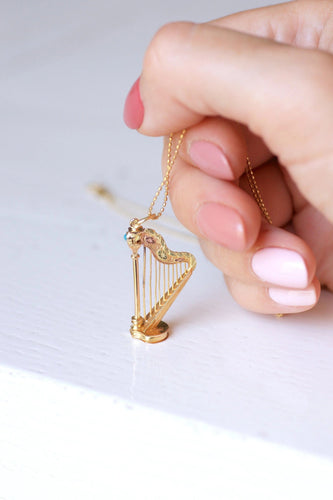 Pendentif Pendentif Victorien Harpe en or jaune et turquoise à compartiment secret 58 Facettes