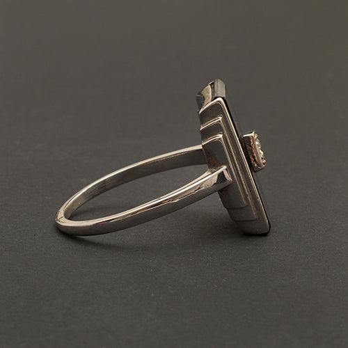 Bague Bague Art Déco en or gris, onyx et diamant "Blink" 58 Facettes 1966