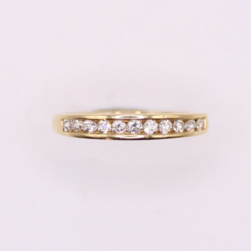 Bague Alliance demi-tour or jaune et diamants serti rail 58 Facettes